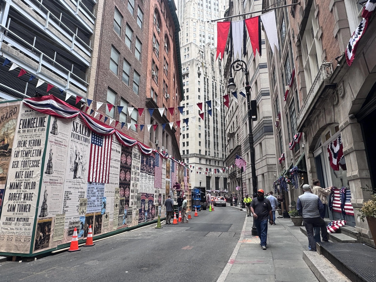 South William Street dressed for Gilded Age Season 4 filming — 1880s theater posters, 38-star flags, and patriotic bunting line the narrow cobblestone street